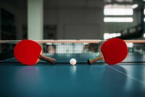 depositphotos_157923648-stock-photo-table-tennis-rackets-and-ball